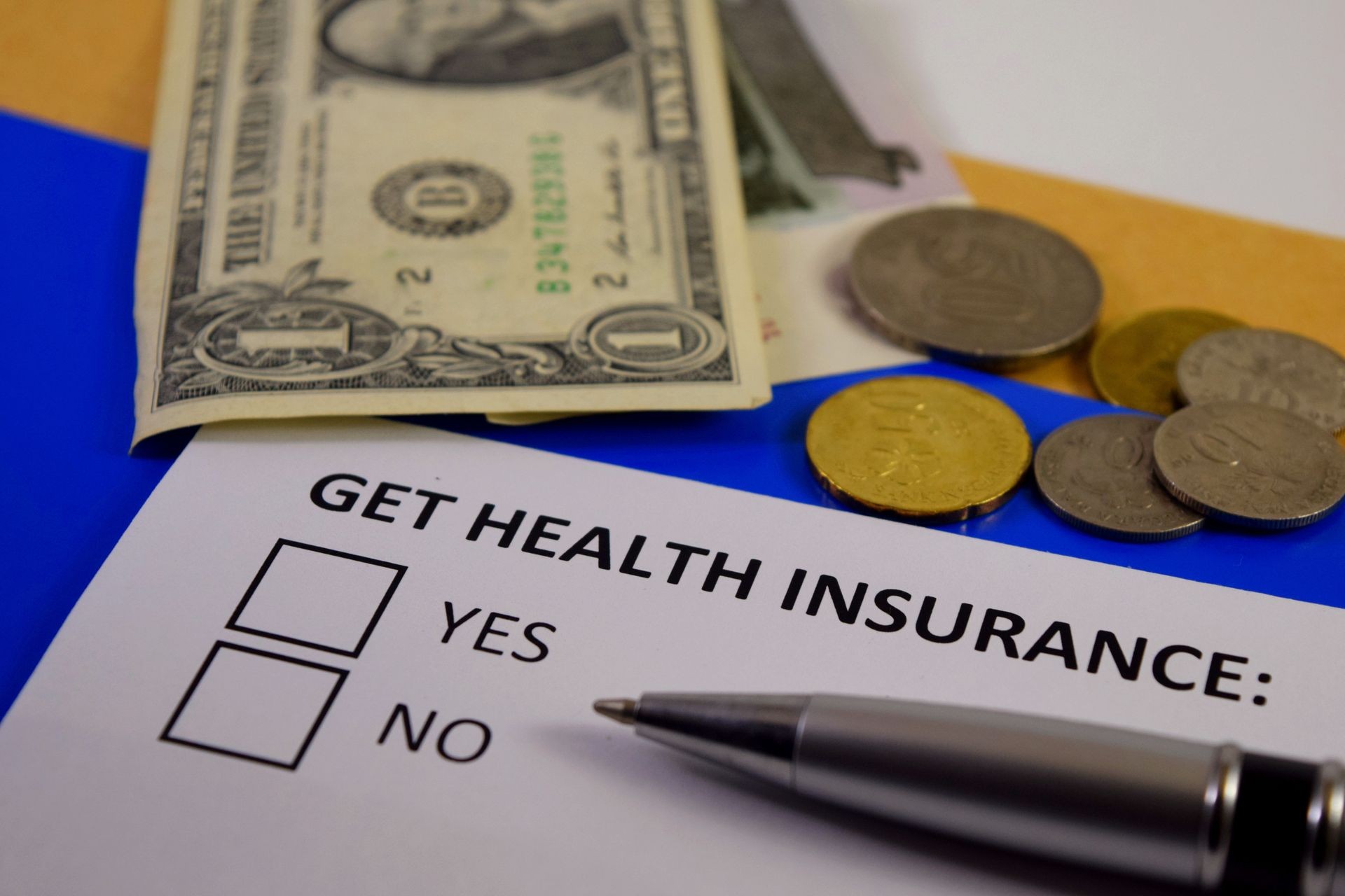 Health insurance - This is a photo consisting money and a form of getting health insurance. This is suitable for advertisement promoting health insurance.
